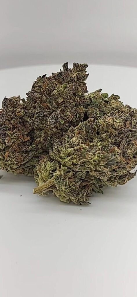 Phantom Cookies is a hybrid cannabis strain, often leaning towards sativa-dominant, known for its sweet, earthy aroma and flavor with notes of cherry and vanilla. It's a cross between Cherry Pie and Granddaddy Purple. This strain is appreciated for its balanced effects, offering both a relaxing body high and a cerebral, uplifting experience. It's sometimes associated with increased creativity and socialization